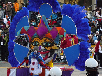 photo of a child pulling a float of a jester