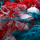 thumbnail of photo of pile of yarn on sofa