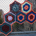 thumbnail of photo of a yarn bombed fence